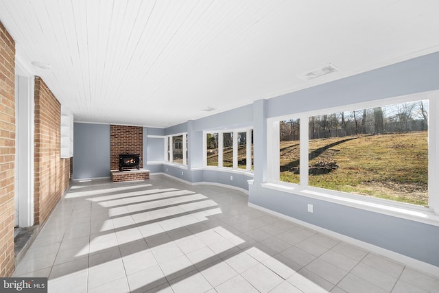 unfurnished sunroom with a fireplace