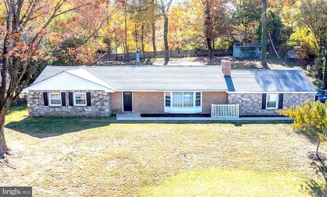 single story home with a front yard