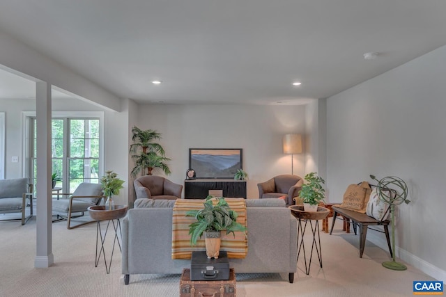 living room featuring light carpet