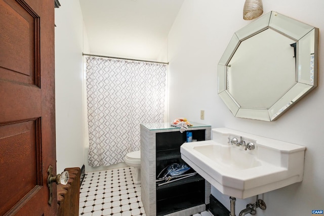 bathroom with shower / bath combo and toilet