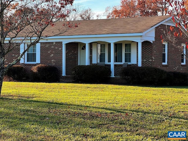 view of front of property with a front lawn and covered porch