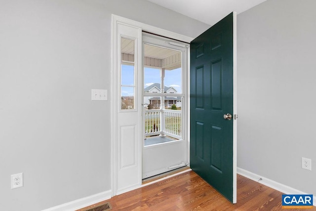 foyer entrance with hardwood / wood-style floors