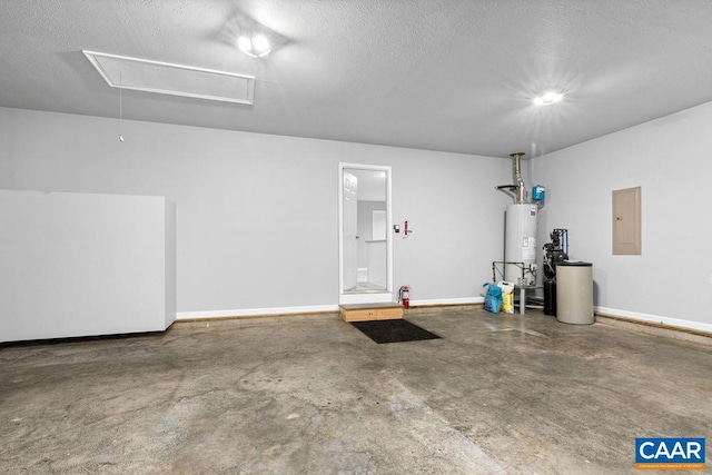 garage featuring white refrigerator, electric panel, and water heater