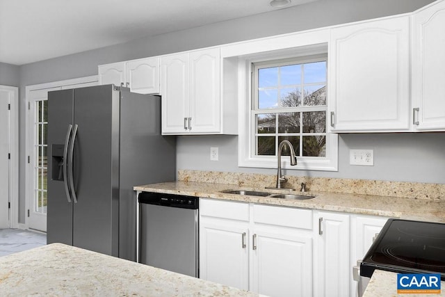 kitchen with white cabinets, sink, and appliances with stainless steel finishes