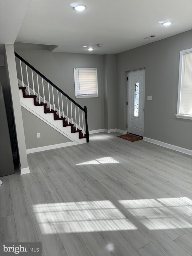 entrance foyer featuring light hardwood / wood-style floors