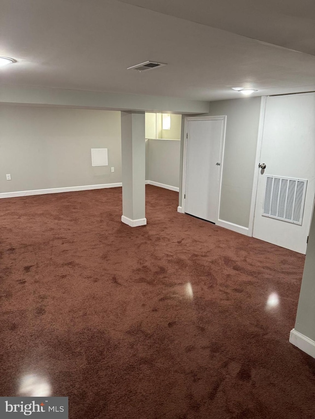 basement with dark carpet