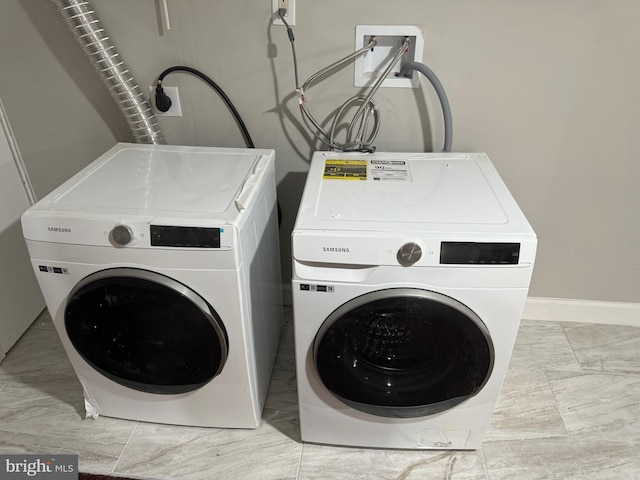 laundry room with washer and dryer