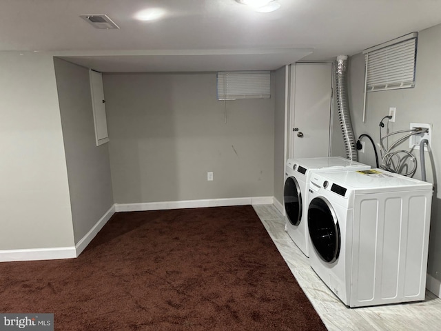 laundry room featuring light carpet and independent washer and dryer