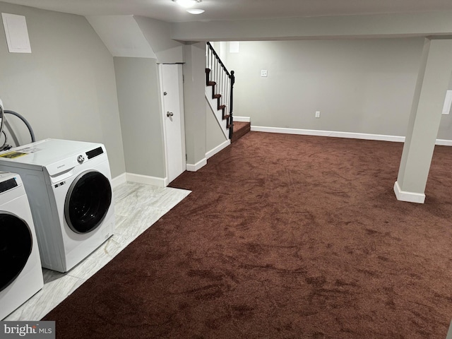 laundry area with washer and dryer and dark colored carpet