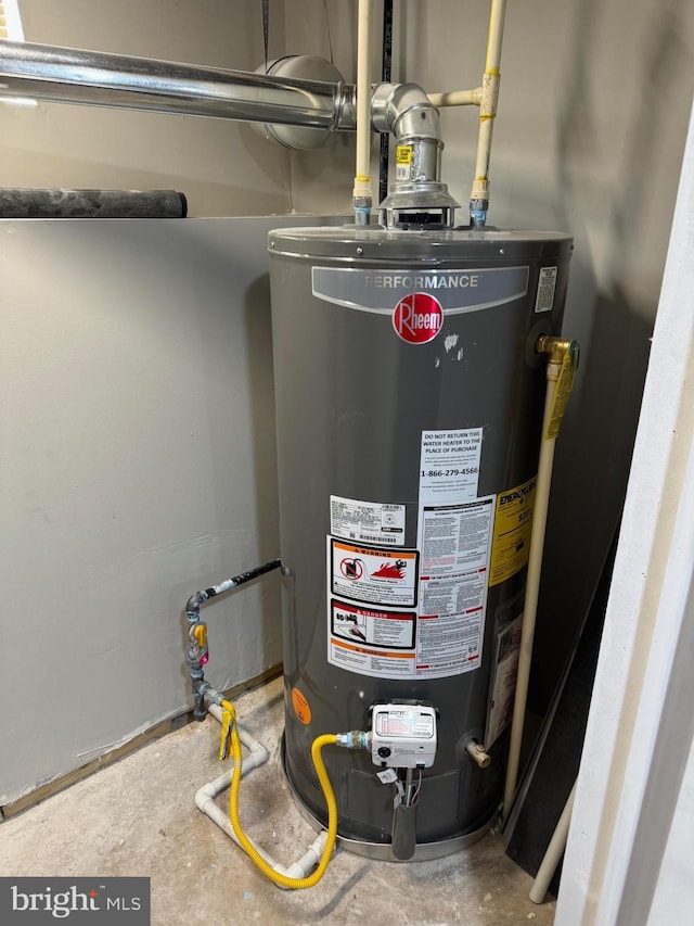 utility room featuring gas water heater