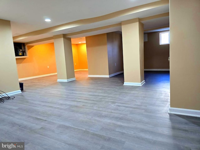 basement featuring hardwood / wood-style flooring