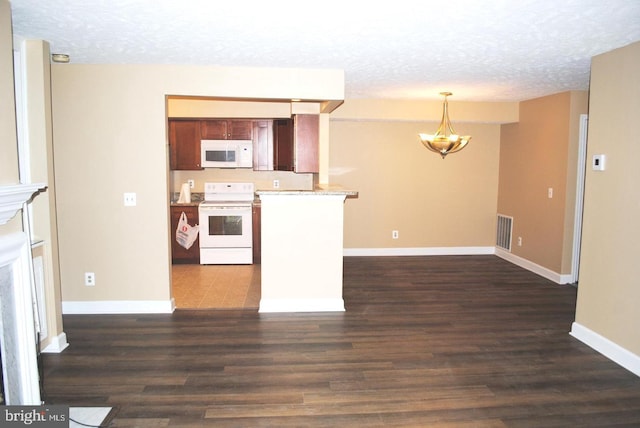 kitchen with white appliances, hanging light fixtures, a textured ceiling, dark hardwood / wood-style flooring, and a chandelier