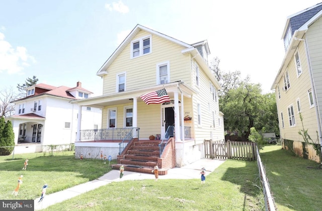 view of front of home with a front lawn and covered porch