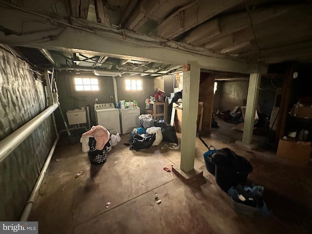 basement with washing machine and dryer and sink