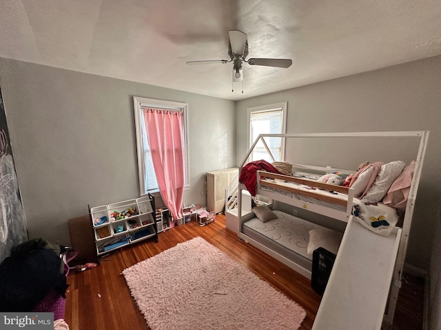 bedroom featuring ceiling fan and dark hardwood / wood-style flooring