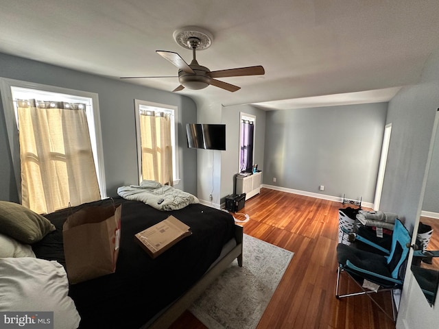 bedroom with ceiling fan and hardwood / wood-style flooring