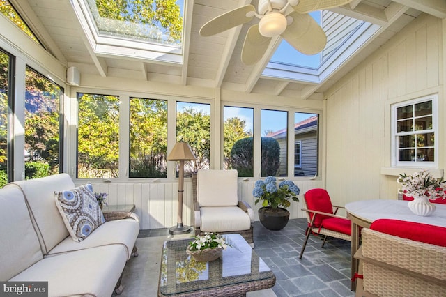 sunroom / solarium featuring lofted ceiling with beams, a wealth of natural light, and ceiling fan