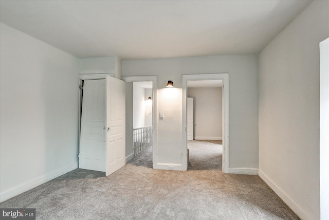 unfurnished bedroom with carpet flooring