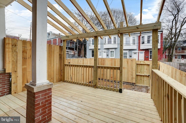 wooden deck featuring a pergola