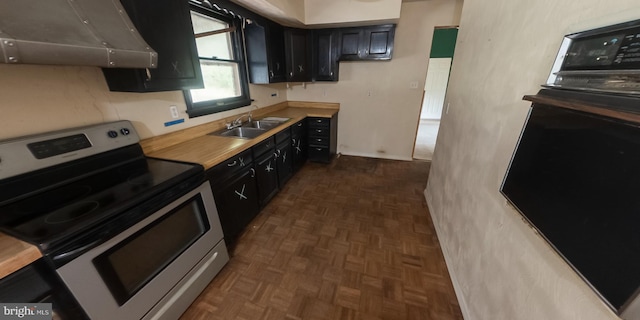 kitchen featuring sink, dark parquet floors, and black appliances