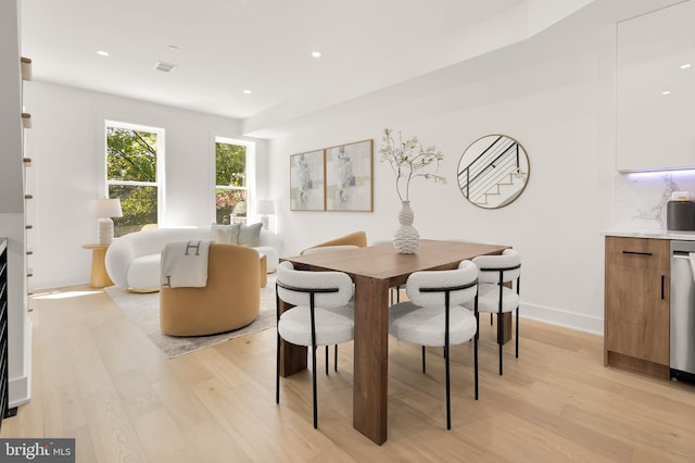 dining area featuring light wood-type flooring