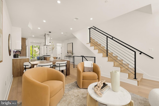 living room with light hardwood / wood-style floors