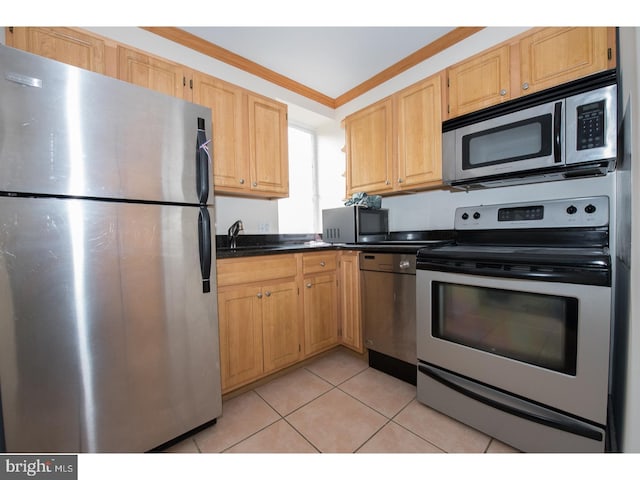 kitchen with sink, light tile patterned floors, ornamental molding, light brown cabinetry, and appliances with stainless steel finishes