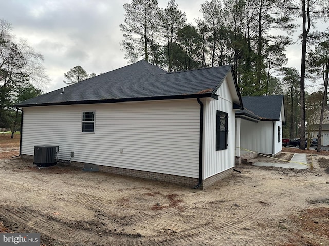 view of side of property featuring cooling unit