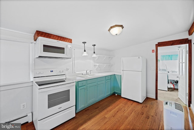 kitchen featuring sink, hanging light fixtures, a baseboard heating unit, washer / clothes dryer, and white appliances