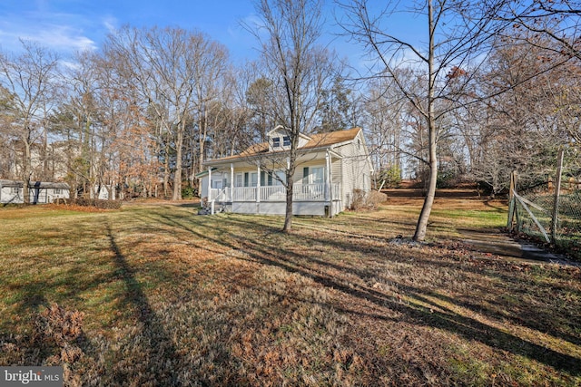 view of yard featuring covered porch