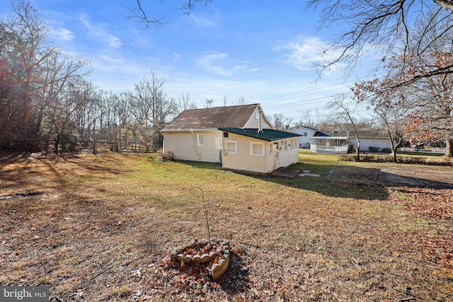 view of side of property featuring a yard