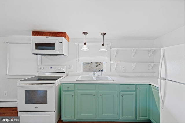 kitchen featuring sink, a baseboard heating unit, decorative light fixtures, white appliances, and green cabinetry