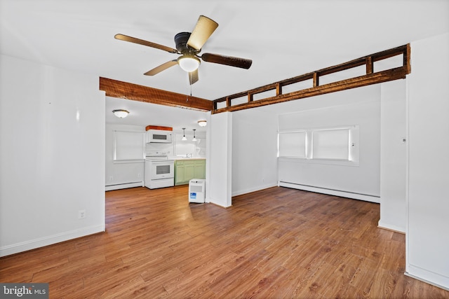 unfurnished living room with light wood-type flooring, baseboard heating, and ceiling fan