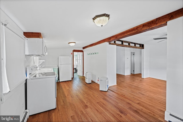 kitchen with light hardwood / wood-style floors, white appliances, baseboard heating, ceiling fan, and washer / clothes dryer