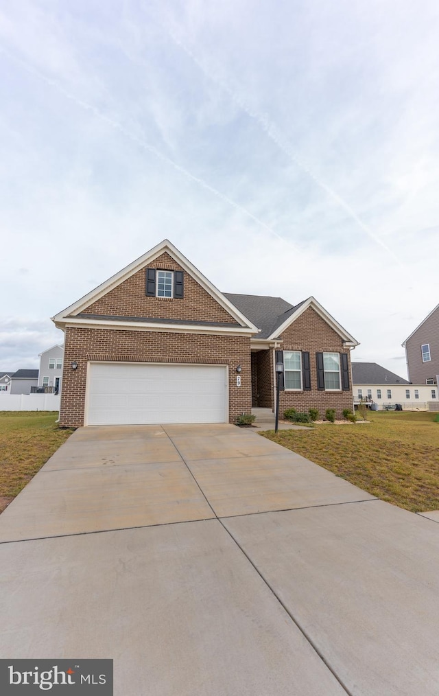 ranch-style home with a garage and a front lawn