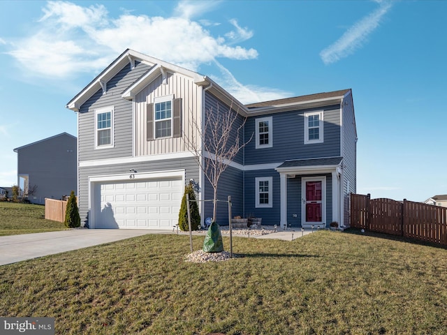 view of front property with a front yard and a garage