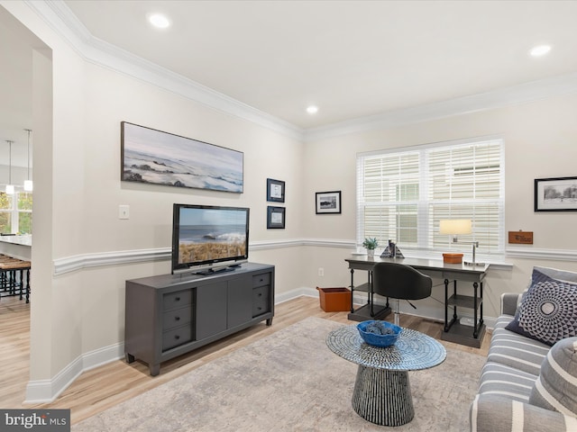 living room with light hardwood / wood-style floors and crown molding