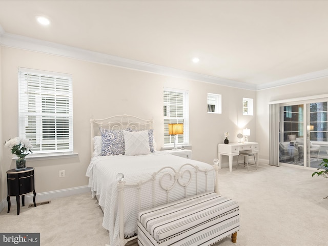 bedroom featuring crown molding, light carpet, and multiple windows