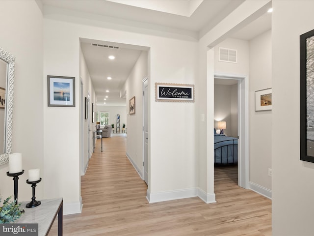 corridor featuring light hardwood / wood-style flooring