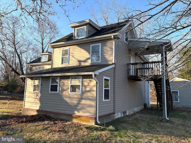 view of property exterior featuring a storage unit