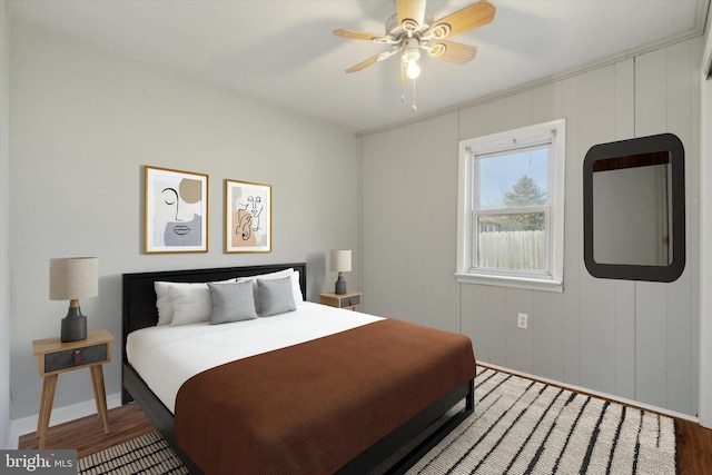 bedroom with hardwood / wood-style floors and ceiling fan