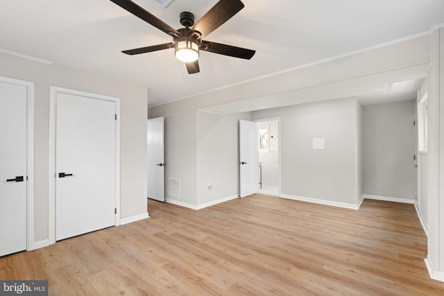 unfurnished bedroom with ceiling fan and light wood-type flooring