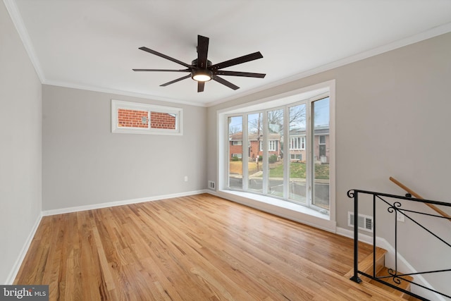 unfurnished room featuring ceiling fan, light hardwood / wood-style floors, and crown molding