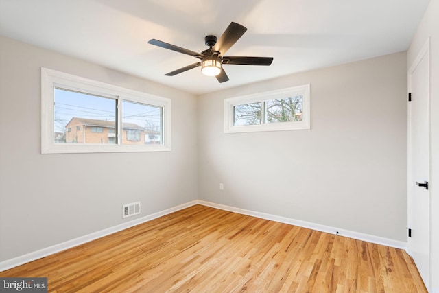 spare room with ceiling fan and light hardwood / wood-style flooring