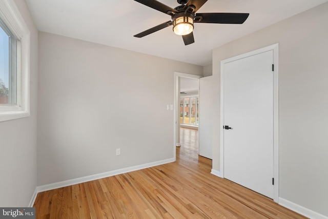 unfurnished bedroom featuring light hardwood / wood-style floors and ceiling fan