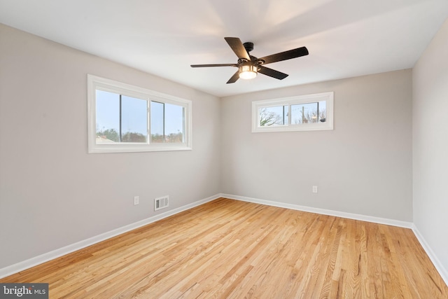 unfurnished room with ceiling fan and light hardwood / wood-style flooring