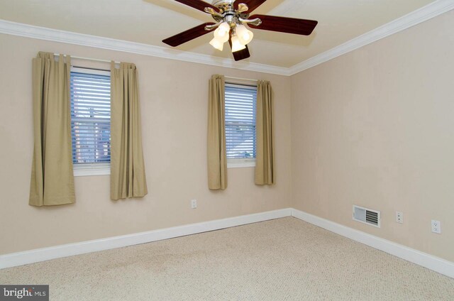 carpeted empty room with ceiling fan and ornamental molding