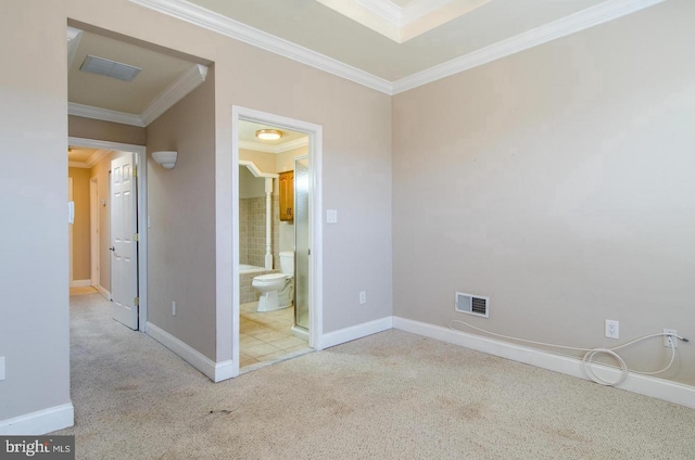 unfurnished bedroom featuring light carpet, ensuite bath, and crown molding