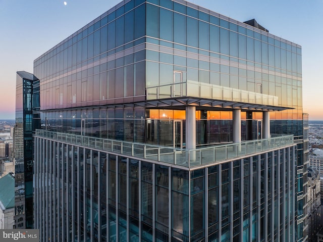 view of outdoor building at dusk