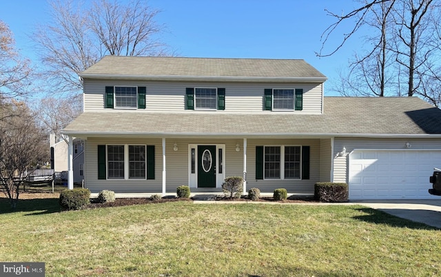 view of front of house featuring covered porch, a garage, and a front lawn